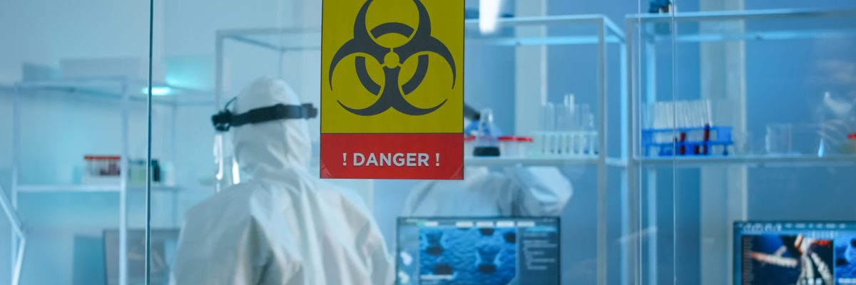 Scientist team in protective suit preparing tools for analysing virus development Scientist team in protective suit preparing tools for analysing virus development in danger zone of laboratory. Team of scientists analysing vaccine evolution using high tech for researching treatment